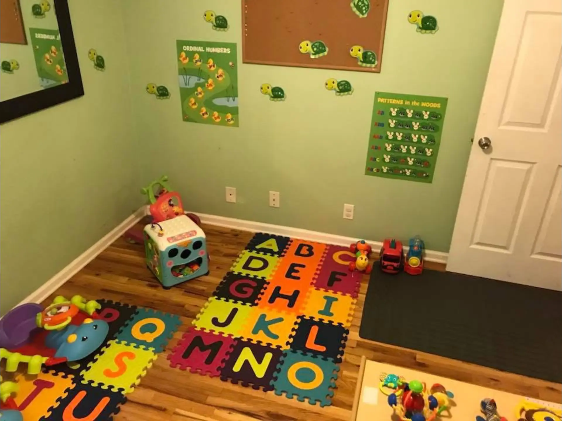 Learning room with alphabet floor mats and educational posters